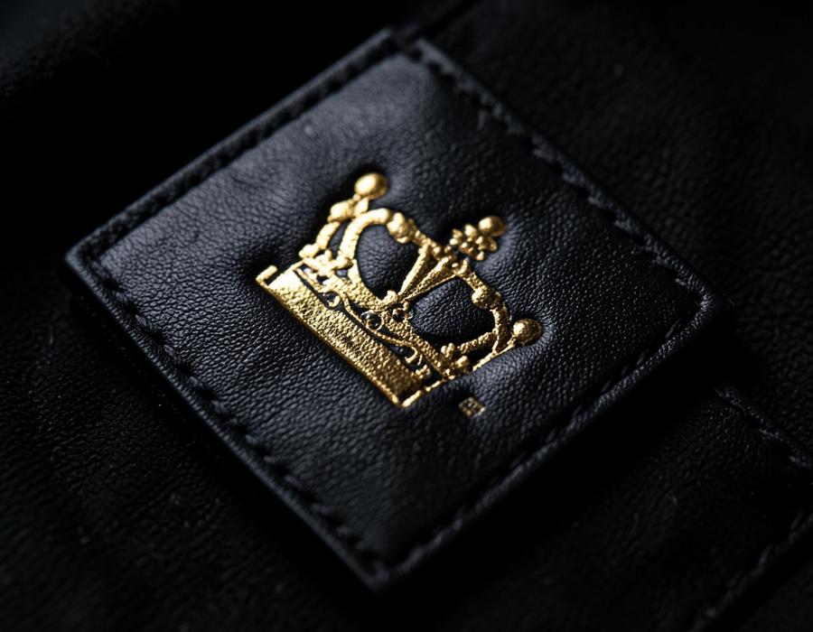 Empire crown label on black leather